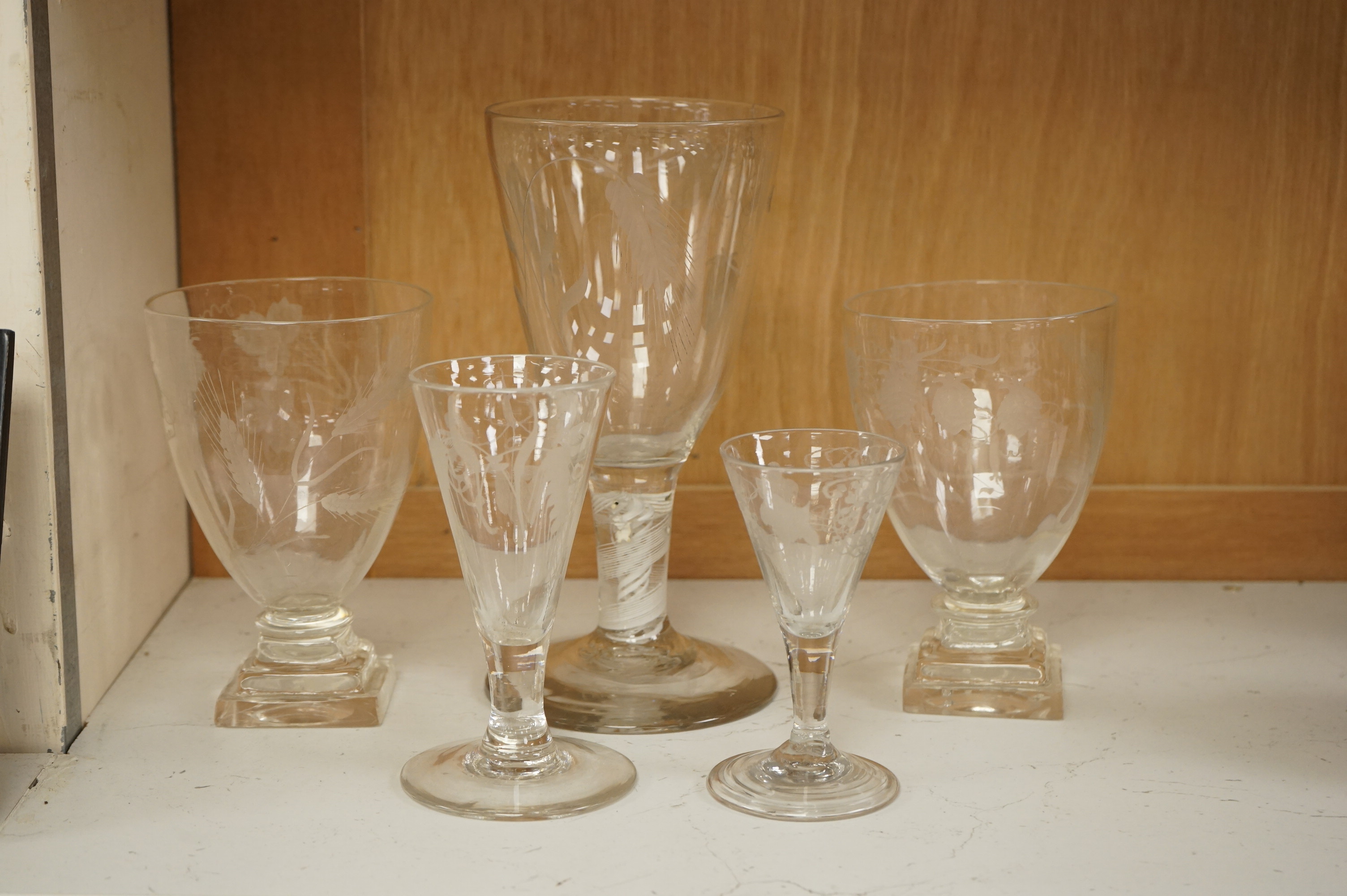 A group of 18th/early 19th century ale glasses, including two rummers, a large DSOT stem glass and two smaller funnel shaped glasses, largest 21cm high (5)
